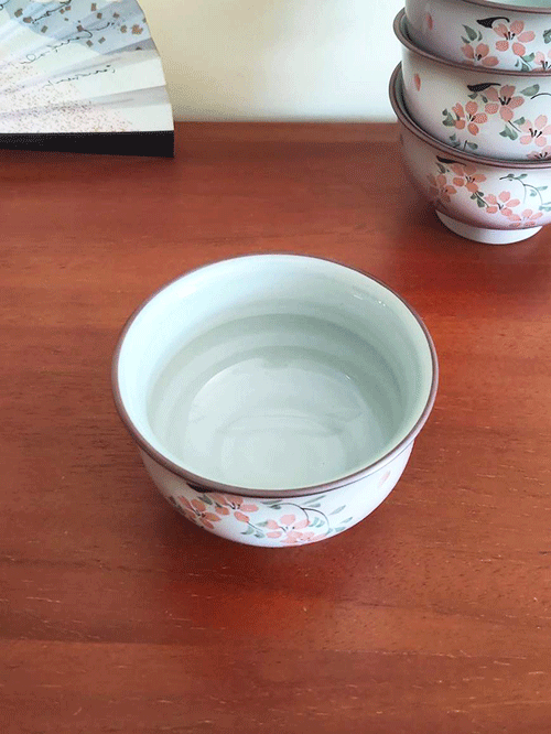 This exquisite teacup features delicate cherry blossoms and leaves painted on the front, with soft, pale purplish-pink hues and scattered Sakura petals adorning the entire surface. A true blend of elegance and tradition, this cup is perfect for both everyday use and as a decorative piece. Available at j-okini.com in Malta