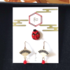 These unique earrings feature a set of three pieces, including a pair of fan-shaped earrings and a single Japanese festival mask Tengu earring inspired by traditional performing arts. Available at j-okini.com in Malta