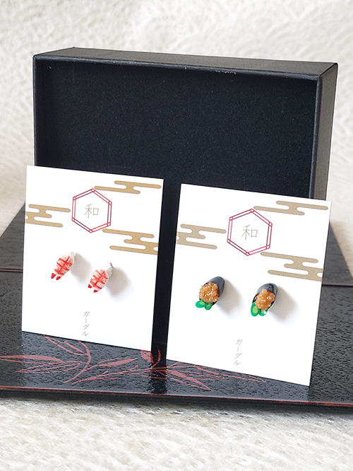 Fun earrings shaped like Japanese sushi. Choose between shrimp ('ebi') and sea urchin ('uni') designs. Colorful and under 1cm, suitable for both men and women. Available at j-okini in Malta