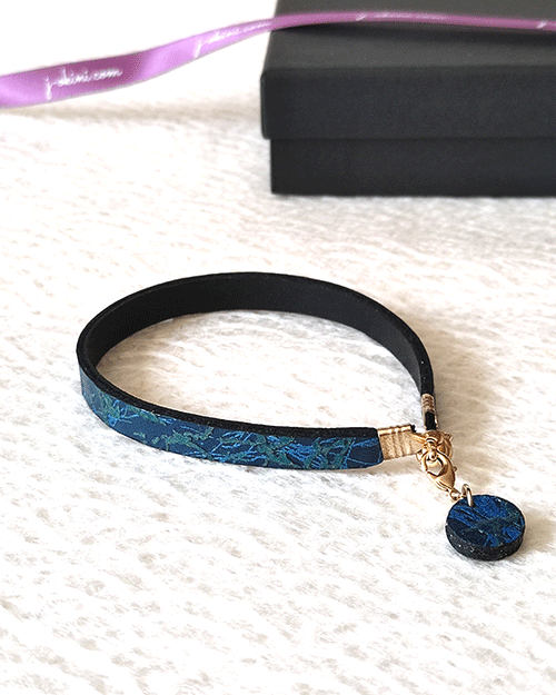 Ocean Twilight Japanese handmade leather bracelet with a textured deep blue and blue-green pattern, featuring a matching charm and magnetic clasp. Made in Japan. Gifts from Japan. j-okini.com in Malta