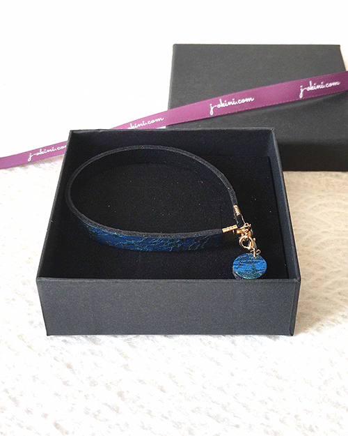 Ocean Twilight Japanese handmade leather bracelet with a textured deep blue and blue-green pattern, featuring a matching charm and magnetic clasp. Made in Japan. Gifts from Japan. j-okini.com in Malta