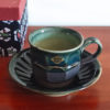 Handmade Kiyomizu Ware Coffee Cup and Saucer Set in deep Oribe green by Ando Mitsuru, showcasing texture contrasts and traditional Japanese craftsmanship.. Buy it from j-okini in Malta