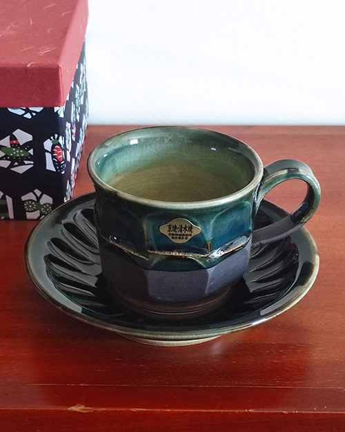 Handmade Kiyomizu Ware Coffee Cup and Saucer Set in deep Oribe green by Ando Mitsuru, showcasing texture contrasts and traditional Japanese craftsmanship.. Buy it from j-okini in Malta