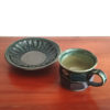 Handmade Kiyomizu Ware Coffee Cup and Saucer Set in deep Oribe green by Ando Mitsuru, showcasing texture contrasts and traditional Japanese craftsmanship.. Buy it from j-okini in Malta