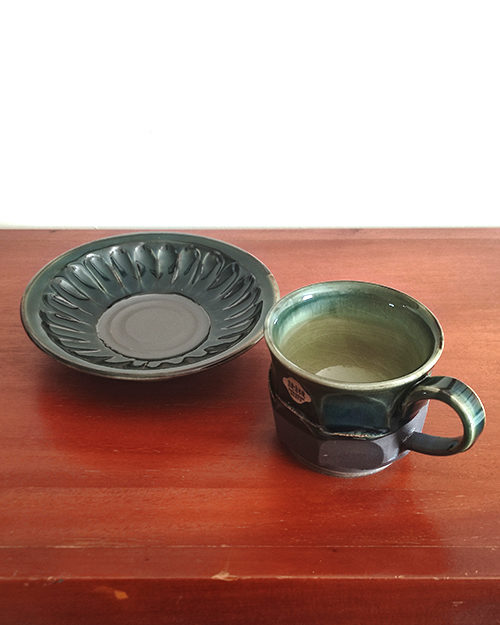 Handmade Kiyomizu Ware Coffee Cup and Saucer Set in deep Oribe green by Ando Mitsuru, showcasing texture contrasts and traditional Japanese craftsmanship.. Buy it from j-okini in Malta