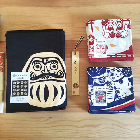 Large daruma furoshiki, small inari Kitsune furoshiki and Manekineko, Nanakorobi yaoki bamboo bookmark