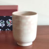 Kiyomizu-ware Yunomi tea cup featuring Red Fuji and crane design on a warm beige base with subtle orange-pink flecks. Available at j-okini.com in Malta