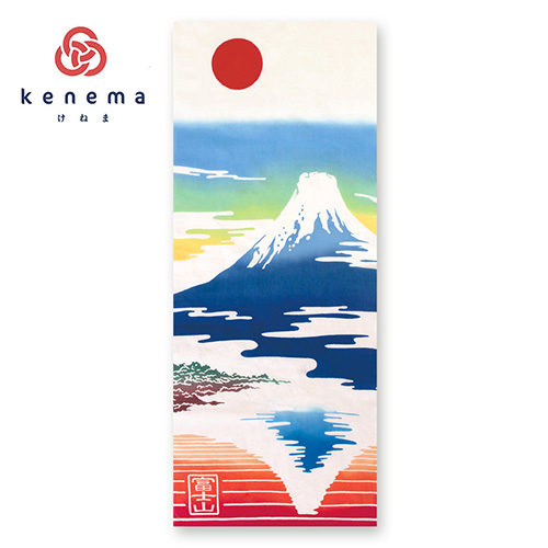 Hand-dyed Tenugui featuring Mount Fuji, its reflection in a lake, a red sun, and a colorful gradient sky, with 'Mount Fuji' written in kanji at the bottom left. j-okini in M,alta