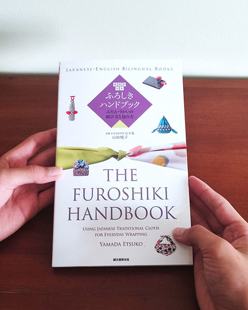 Furoshiki Handbook with English translations, offering ideas for wraps and knots, by Yamada Etsuko.. Available at j-okini.com in Malta