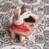 Vintage Wooden Dolls from the Showa Era. A pair of donguri dolls seated on wooden geta sandals, featuring hand-painted details and a mushroom accent.. Available at j-okini.com in Malta