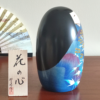 Handcrafted Kokeshi doll named Hana no Kokoro,by Usaburo adorned with floral patterns, symbolizing a heart of flowers and expressing grace and beauty in Japanese artistry.. Buy it online at j-okini.com in Malta