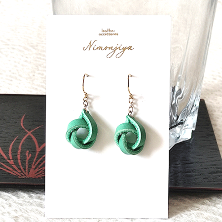 Handmade leather earrings with a delicate twist design in a traditional Japanese Hisui (jade green) color, showcasing Kyo-Yuzen dyeing craftsmanship. Gift idea from j-okini.com in Malta