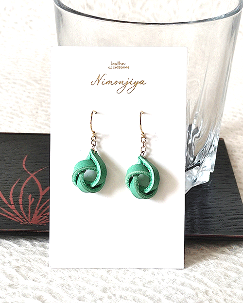 Handmade leather earrings with a delicate twist design in a traditional Japanese Hisui (jade green) color, showcasing Kyo-Yuzen dyeing craftsmanship. Gift idea from j-okini.com in Malta