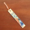 Handcrafted bamboo bookmark featuring Kaguyahime from The Tale of the Bamboo Cutter, with unique colored thread and '竹しおり' (bamboo bookmark) written on the back. j-okini.com in Malta