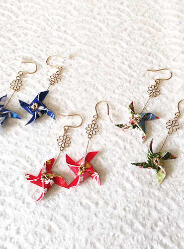 Washi Kazaguruma Earrings. Handcrafted with traditional Japanese Washi paper, these charming earrings feature a whimsical Kazaguruma (pinwheel) design. Available at j-okini.com in Malta