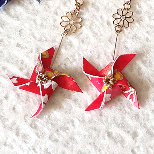 Handmade Japanese earrings made of Washi paper in a shape of Kazaguruma. in red. Available at j-okini.com in Malta