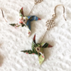 Hand crafted earrings in a shape of green Kazaguruma - (pinwheel) design. A nostalgic symbol of Japan’s summer festivals, the pinwheel spins in the breeze, evoking the carefree days of childhood.. Available at j-okini.com in Malta