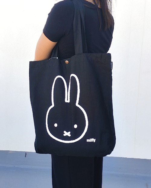 Miffy's Lightweight Canvas Tote Bag featuring a large miffy illustration. Black tote bag with two extra pockets. Available at j-okini.com in Malta