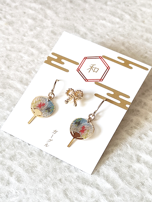 Buy Japanese earring set including two mini uchiwa fan featuring a goldfish motif earrings with hooks , paired with a cute ribbon stud earring. Uchiwa fan has the desi Made in Japan! Available at j-okini.com in Malta