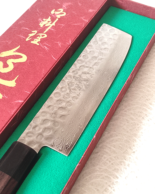 Handcrafted Japanese Nakiri kitchen knife with a hammered and wave-patterned AUS10 stainless steel blade, octagonal rosewood handle, and traditional craftsmanship. Available at j-okini in Malta