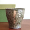 Handcrafted Kiyomizu-yaki Oribe glaze free cup with Kozou Kiln stamp on the bottom, gold accents, and textured surface, 9cm tall, ideal for tea, coffee, or whisky. Buy it from j-okini in Malta