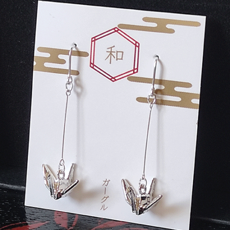 The origami crane, a symbol of peace, is beautifully captured in these earrings with a delicate, three-dimensional motif. Their minimalist design brings a subtle touch of Japanese culture, offering a graceful and elegant accent for any occasion.. Available at j-okini.com in Malta