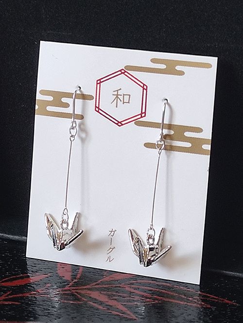 The origami crane, a symbol of peace, is beautifully captured in these earrings with a delicate, three-dimensional motif. Their minimalist design brings a subtle touch of Japanese culture, offering a graceful and elegant accent for any occasion.. Available at j-okini.com in Malta