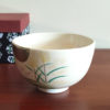 Kiyomizu-ware handmade matcha bowl with Otsukimi moon-viewing design, featuring six rabbits beneath a golden full moon on a cream background, with detailed gold accents on the grasses and rabbits. j-okini.com in Malta