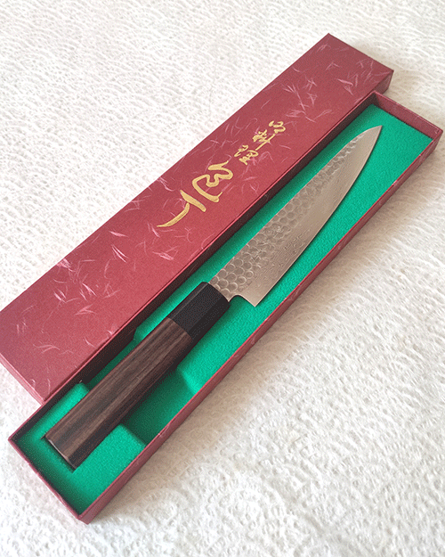 Japanese petty knife with a hammered AUS10 blade and octagonal Shitan rosewood handle. Available at j-okini in Malta