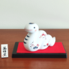 Porcelain Japanese Zodiac white snake figurine with a charming expression, decorated with pine, bamboo, and plum patterns, symbolizing prosperity and renewal. Buy at j-okini in Malta