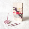 Japanese Sakura incense gift set in a premium paulownia wood box and accompanied by a sakura-shaped incense holder. Wrapped with a Kiku pattern fabric and tied with Mizuhiki. Available at j-okini.com in Malta