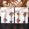 Japanese earrings with a graceful design of Sakura (cherry blossoms) and Sensu fans, elegantly connected in a vertical arrangement. Available at j-okini.com in Malta