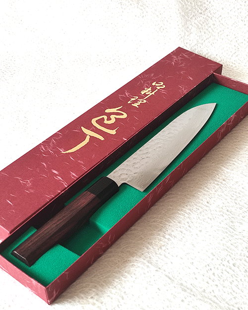 Japanese Santoku kitchen knife with hammered AUS10 blade and rosewood octagonal handle. Available at j-okini in Malta