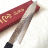 Japanese Santoku kitchen knife with hammered AUS10 blade and rosewood octagonal handle. Available at j-okini in Malta