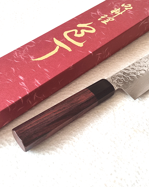 Japanese Santoku kitchen knife with hammered AUS10 blade and rosewood octagonal handle. Available at j-okini in Malta