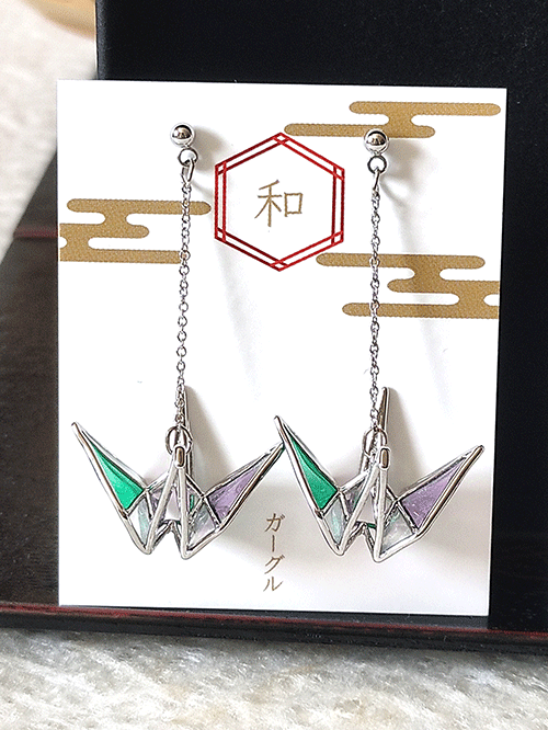 Buy Handmade Stained Glass Origami Crane Earrings, a symbol of peace, is beautifully captured in these earrings with a delicate, three-dimensional motif. Available at j-okini.com in Malta