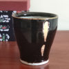 Kiyomizu-yaki free cup with Tenmoku glaze, smooth black surface with golden-brown rim and gold streaks, stamped with Kozou Kiln mark. Buy it from j-okini in Malta