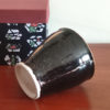 Kiyomizu-yaki free cup with Tenmoku glaze, smooth black surface with golden-brown rim and gold streaks, stamped with Kozou Kiln mark. Buy it from j-okini in Malta