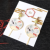 Adorable uchiwa fan-shaped earrings feature a charming design of goldfish swimming gracefully, adding a touch of seasonal elegance to your look. Perfect for a playful yet stylish accessory that evokes the spirit of Japanese summer. Available at j-okini.com in Malta