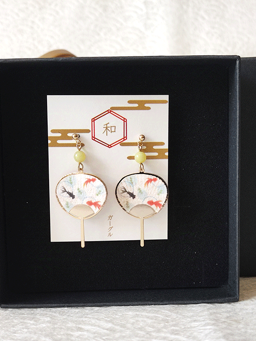 Japanese Goldfish Uchiwa Fan Earrings. Perfect for a playful yet stylish accessory that evokes the spirit of Japanese summer. Made in Japan. Available at j-okini.com in Malta