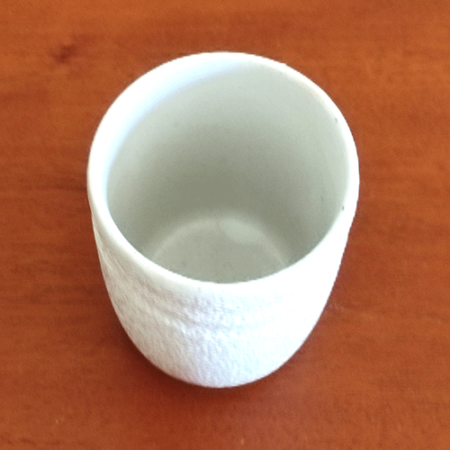 Vintage white teacup with unique textured material. Made in Japan. Cheap cup. Available at j-okini.com in Malta