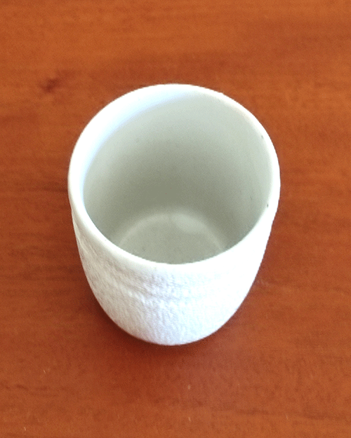 Vintage white teacup with unique textured material. Made in Japan. Cheap cup. Available at j-okini.com in Malta