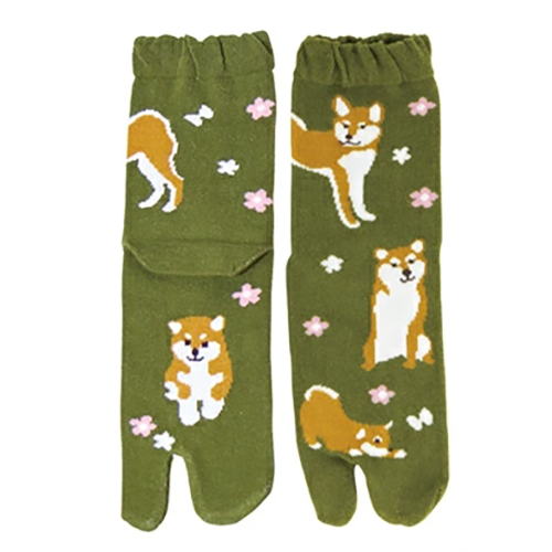 Green Japanese Tabi socks featuring a Shiba Inu in a field of flowers, designed with a split-toe for comfort and support, fits EU sizes 37-40.