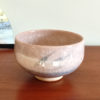 Kiyomizu-ware handmade Matcha bowl by Okayama Kousha, featuring a warm light coral and skin-tone hue with a delicate cracked-glass pattern. Tube-shaped for excellent heat retention, with unique random grey accents on the front. Stamped at the bottom. Made in Japan. Available at j-okini.com in Malta