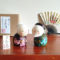 A modern Creative Kokeshi doll set named 'Gochouju' by award-winning artist Sekiguchi Toshio. The dolls depict an elderly couple with kind smiles, dressed in elegant kimono, celebrating longevity and happiness. Handcrafted in Japan. Available at j-okini.com in Malta