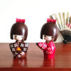 Handcrafted Japanese Kokeshi doll 'Kosode' by artist Kojo, wearing a chic brown kimono with a soft pink collar and a vibrant yellow obi. Available at j-okini.com in Malta