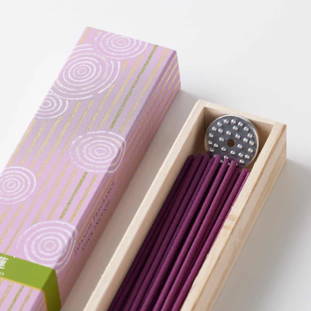 A box of high-quality Kyoto incense featuring a lotus fragrance. The packaging showcases elegant Japanese design, and the set includes long incense sticks along with a small incense stand. Ideal for creating a calming and fragrant atmosphere. Available at j-okini.com in Malta