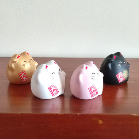 Banko Ware Maneki-Neko in white, pink, gold, and black, each representing different meanings in Feng Shui—health, love, wealth, and protection. Made in Japan. Available at j-okini.com in Malta