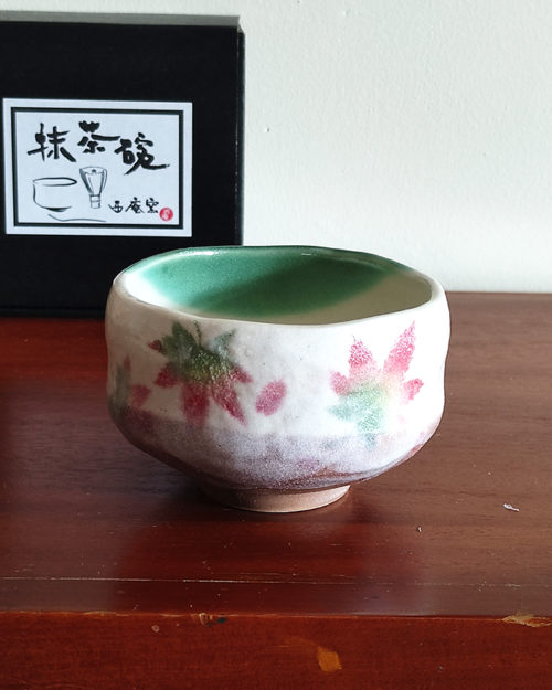 Small Mino Ware Matcha bowl with a cream base and colorful Momiji (Japanese maple leaves) design, handmade in Gifu, Japan. Available at j-okini.com in Malta