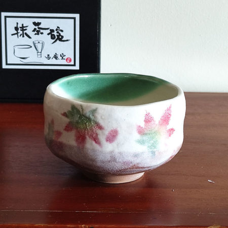 Small Mino Ware Matcha bowl with a cream base and colorful Momiji (Japanese maple leaves) design, handmade in Gifu, Japan. Available at j-okini.com in Malta